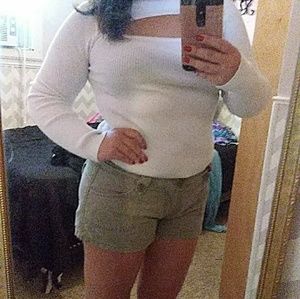 White top, green shorts